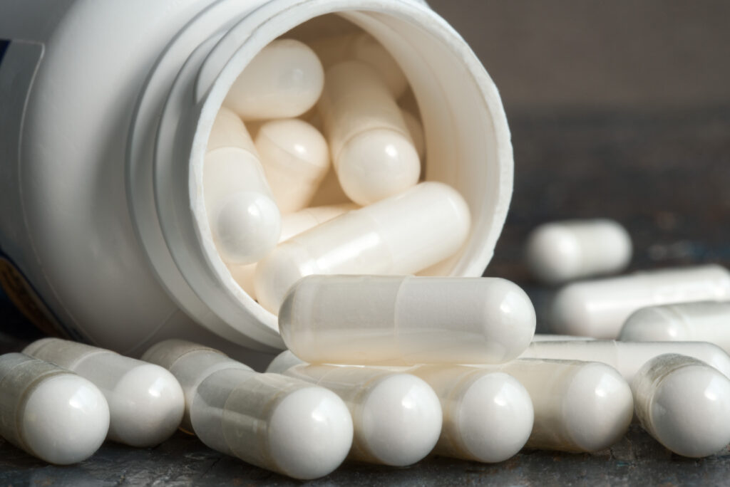 White capsule and bottle